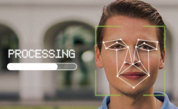 rosto de jovem adulto branco com pontos de marcação virtuais dos olhos à boca para reconhecimento facial de inteligência artificial